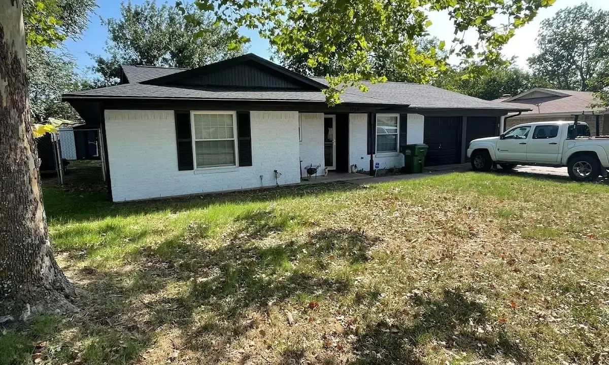 Professional roofing crew working on a residential roof in Jupiter Farms